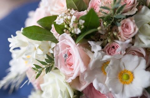 blush flowers engagement ring wedding photography