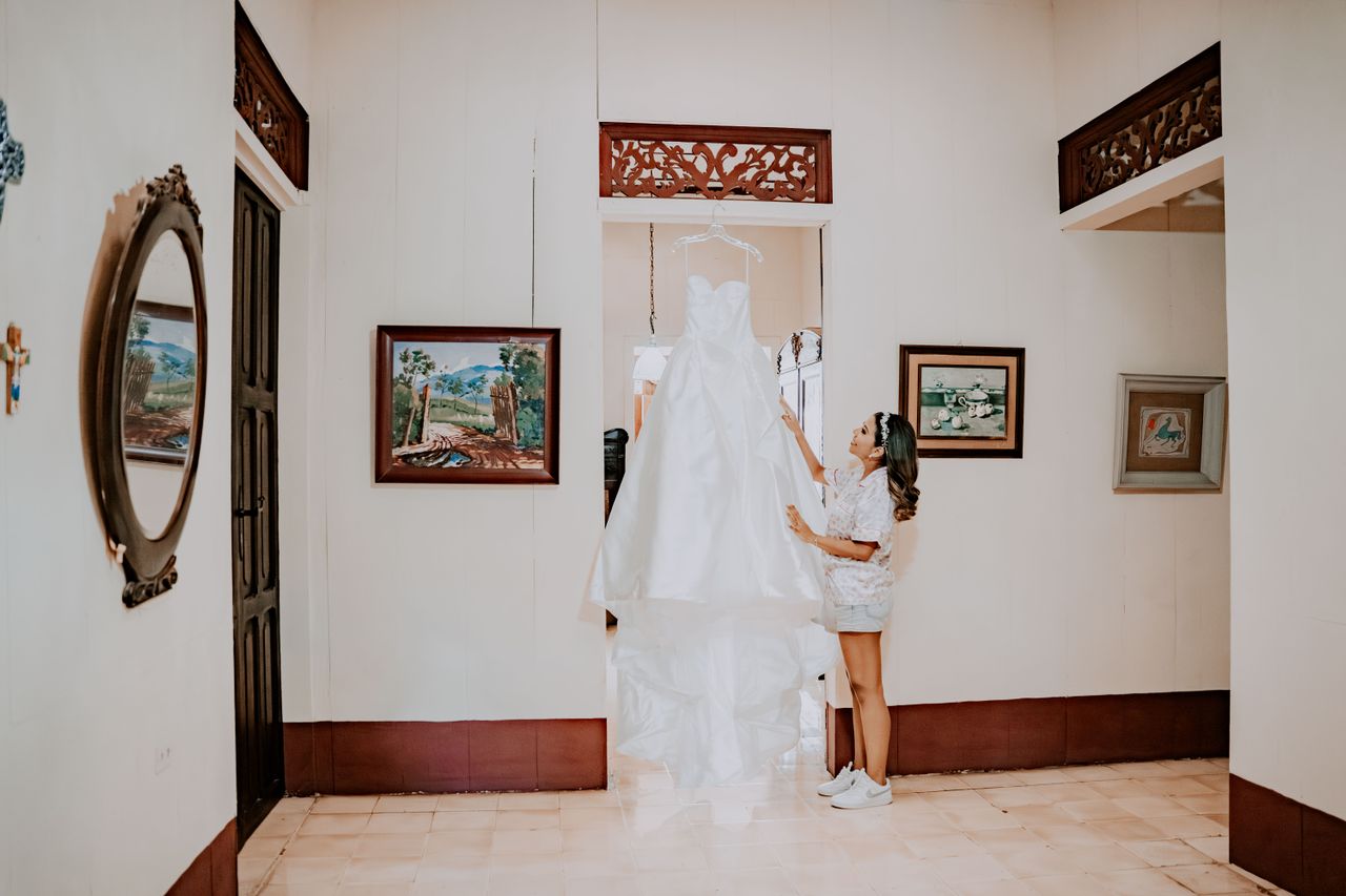 Bride exploring a luxury bridal suite with natural lighting and preparation areas before choosing a venue.