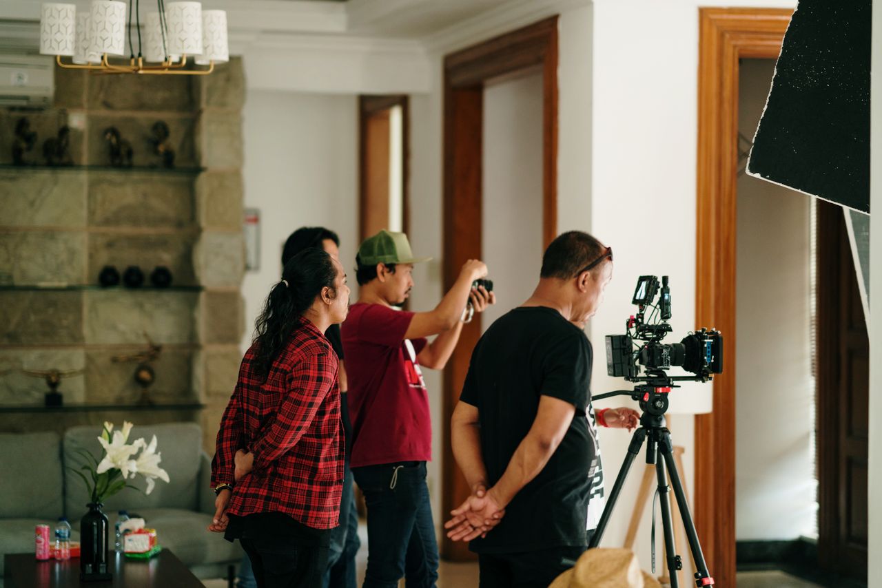 Wedding professionals working behind the scenes to ensure a smooth reception experience for guests.