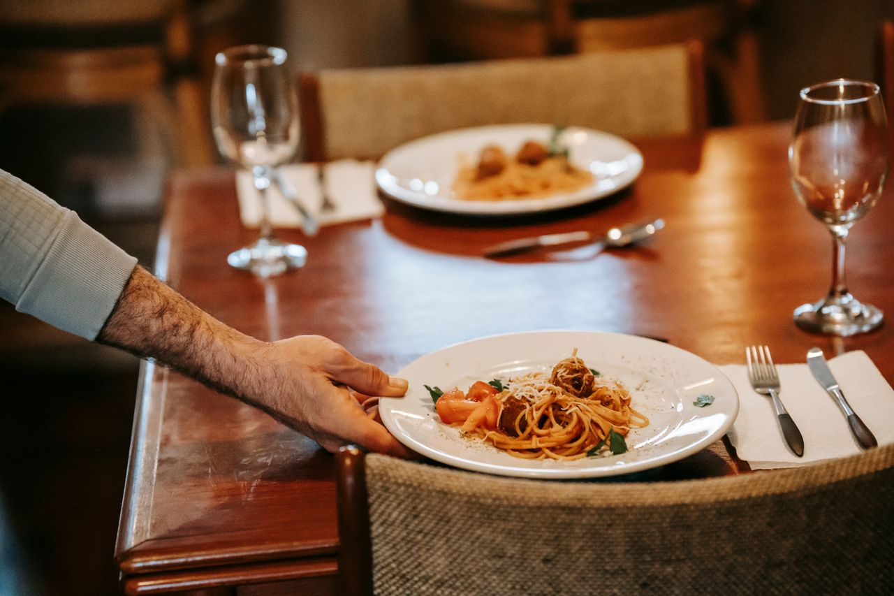 Chef preparing fresh pasta at an interactive wedding food station in Melbourne for a memorable reception experience