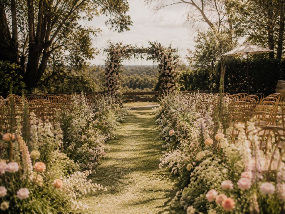 Natural meadow-style aisle flowers creating a beautiful outdoor Melbourne wedding ceremony setting