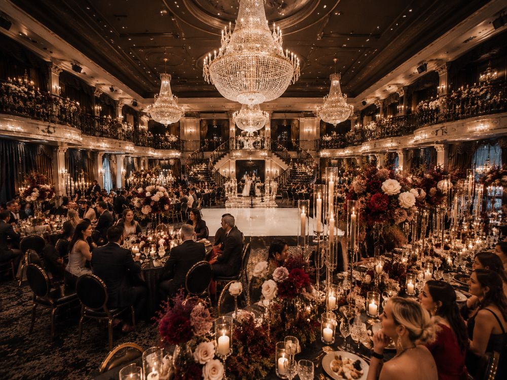 Grand Melbourne wedding ballroom decorated with candles, flowers, chandeliers, and elegant winter styling.