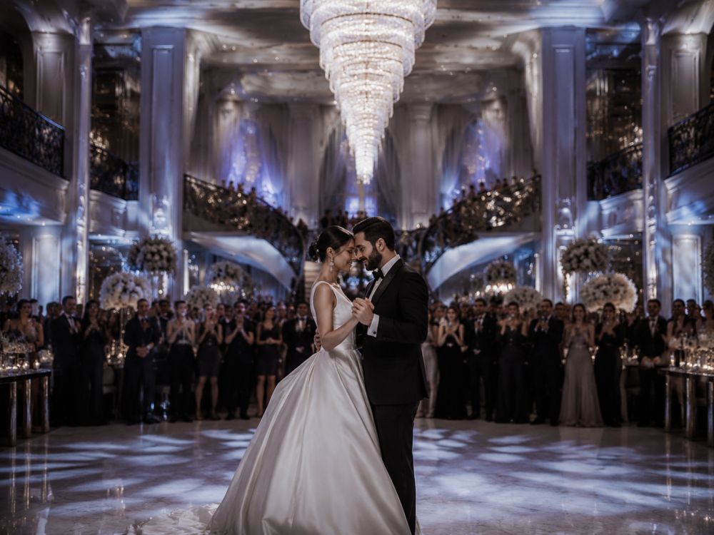neo deco wedding first dance under chandelier lighting