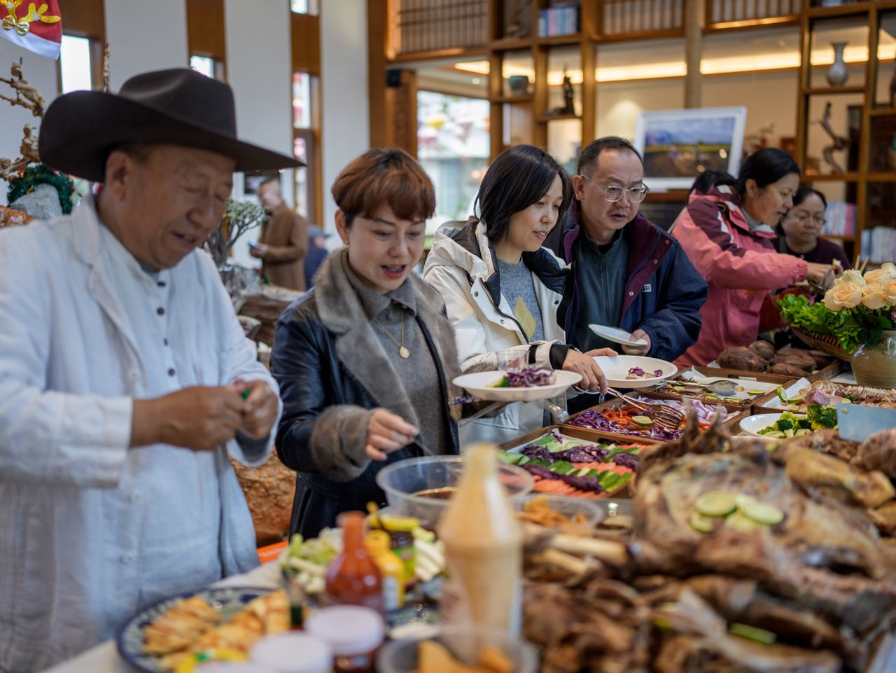 Guests sharing a communal wedding feast with family-style dining dishes inspired by modern Melbourne wedding menus