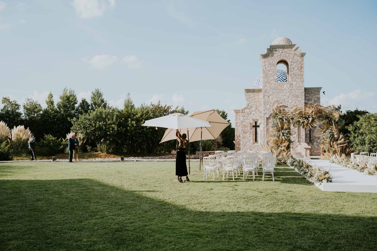 Wedding venue staff preparing for changing weather conditions during an outdoor celebration