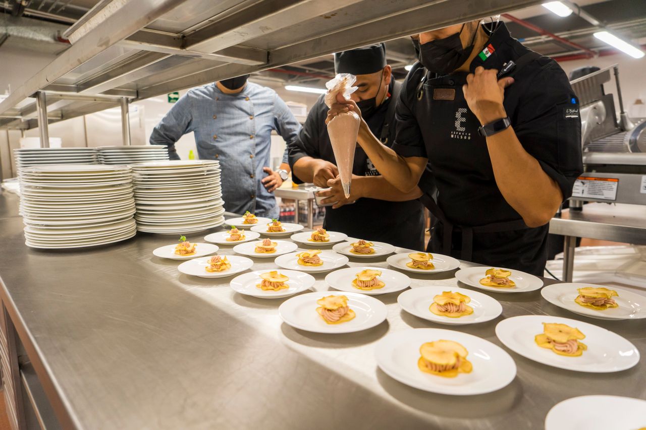 Professional wedding catering staff preparing meals while maintaining a smooth reception schedule