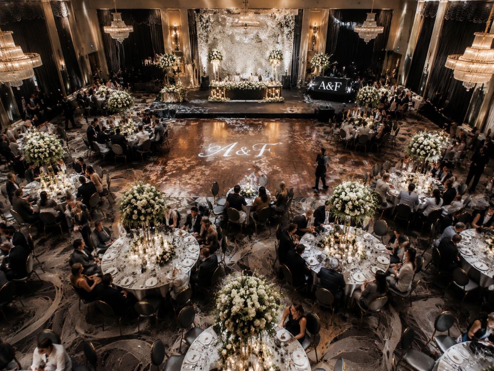 Overhead view of a wedding venue floor plan with tables, dance floor, DJ area and guest pathways