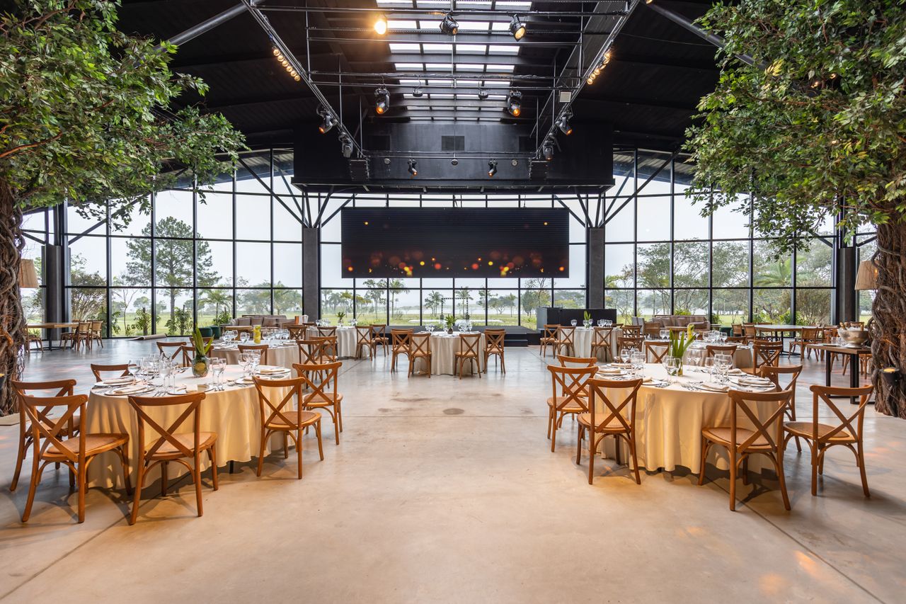 Outdoor wedding ceremony setup with storm clouds showing why reliable venue contingency plans matter.