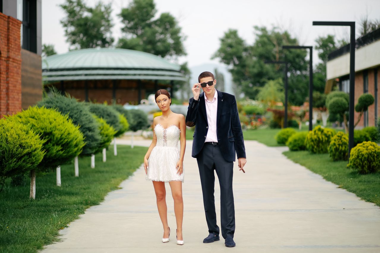 Couple exploring a wedding venue entrance and guest pathway during a professional venue inspection.