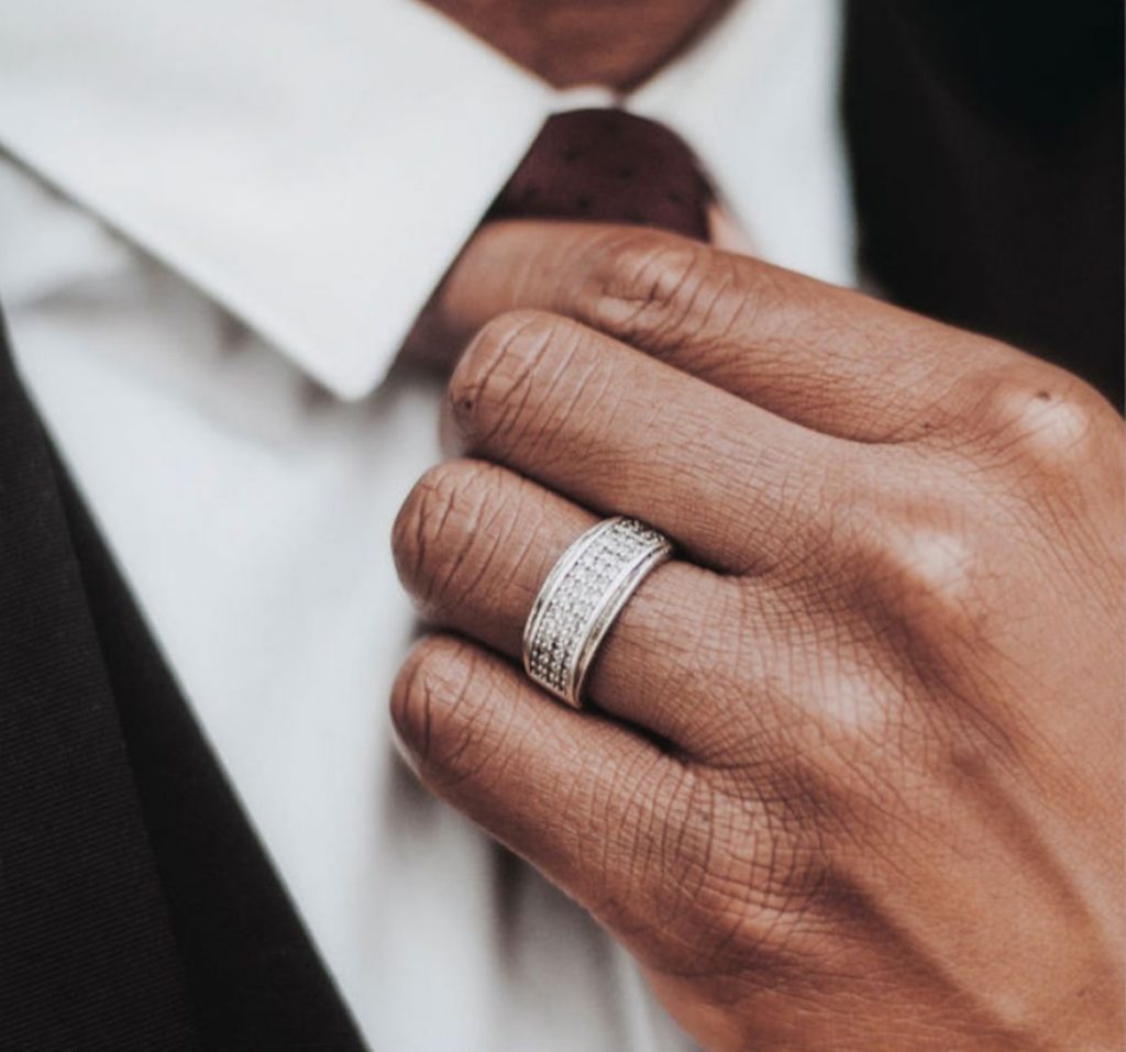 up close of man with proposal ring